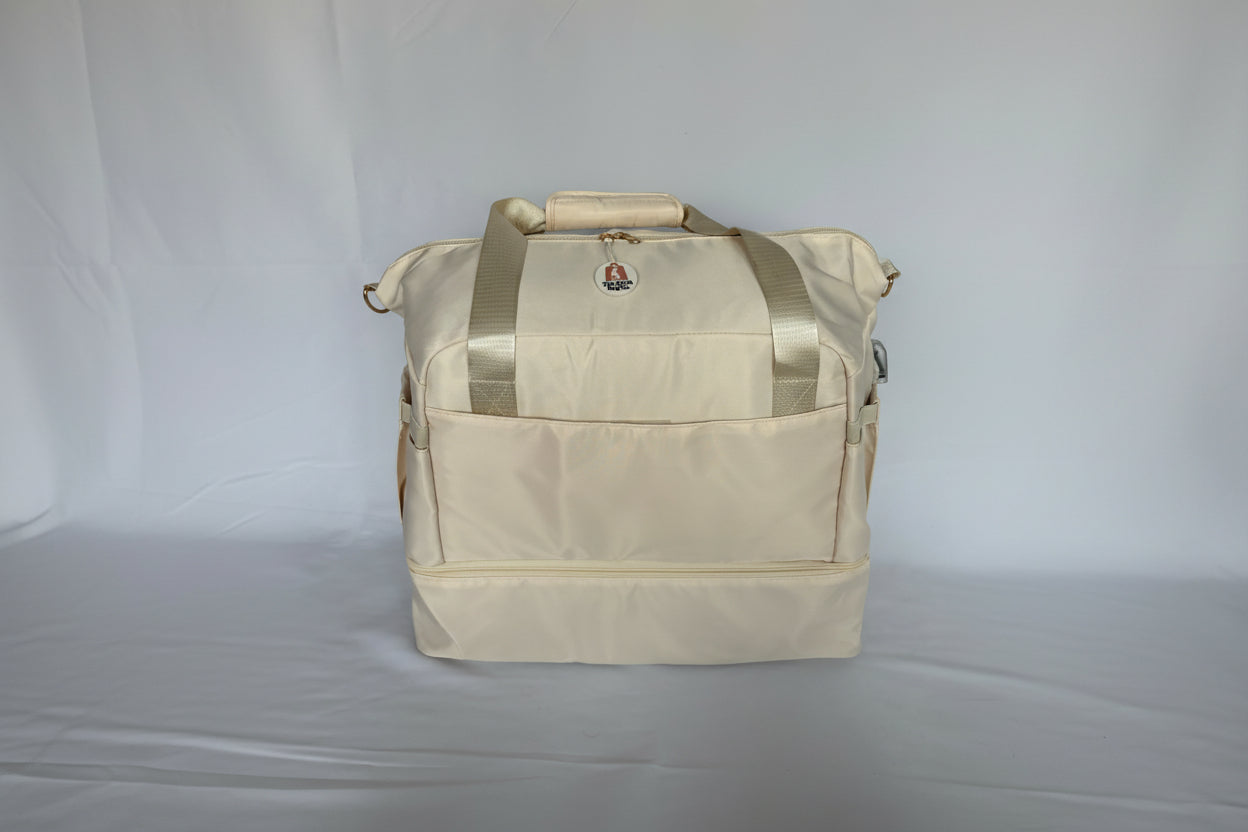 Beige duffel bag with visible brand logo on a white background